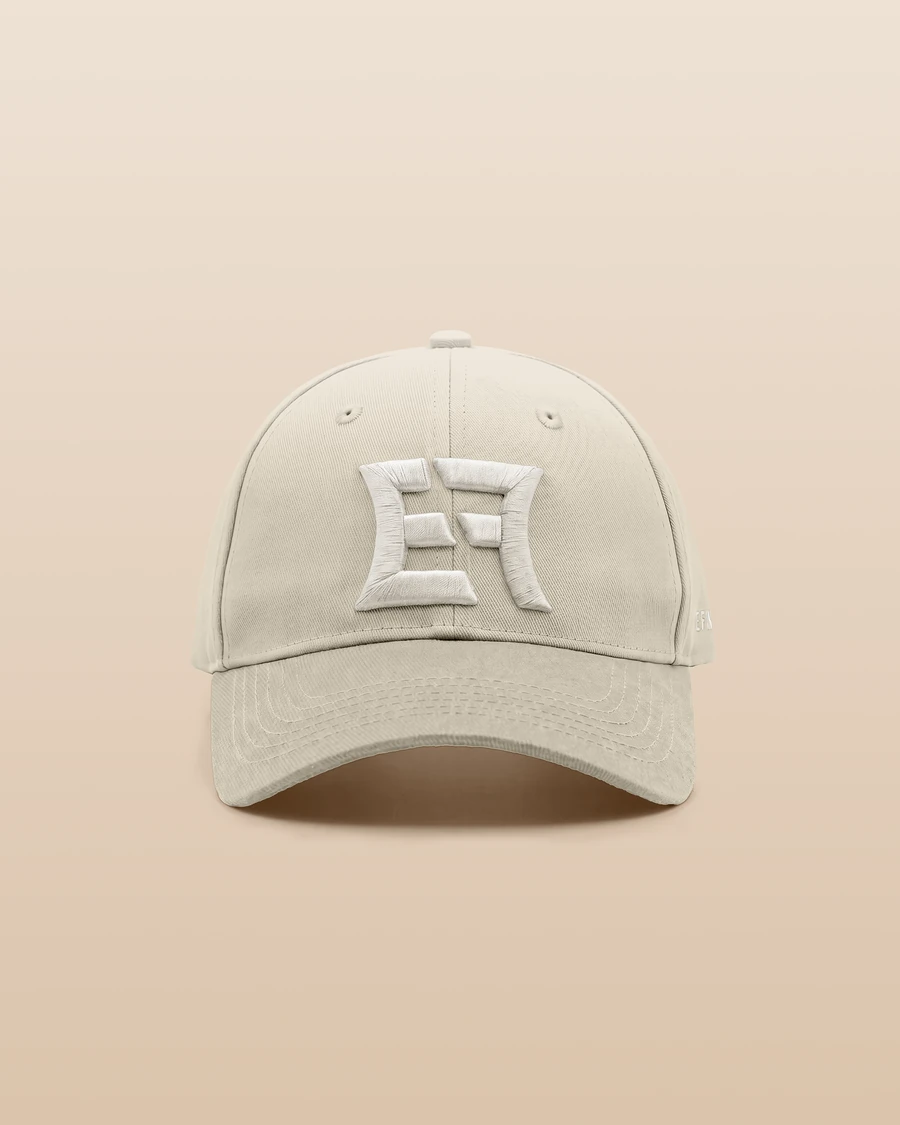 Continuum 02 cap in bleached sand, seen from the front